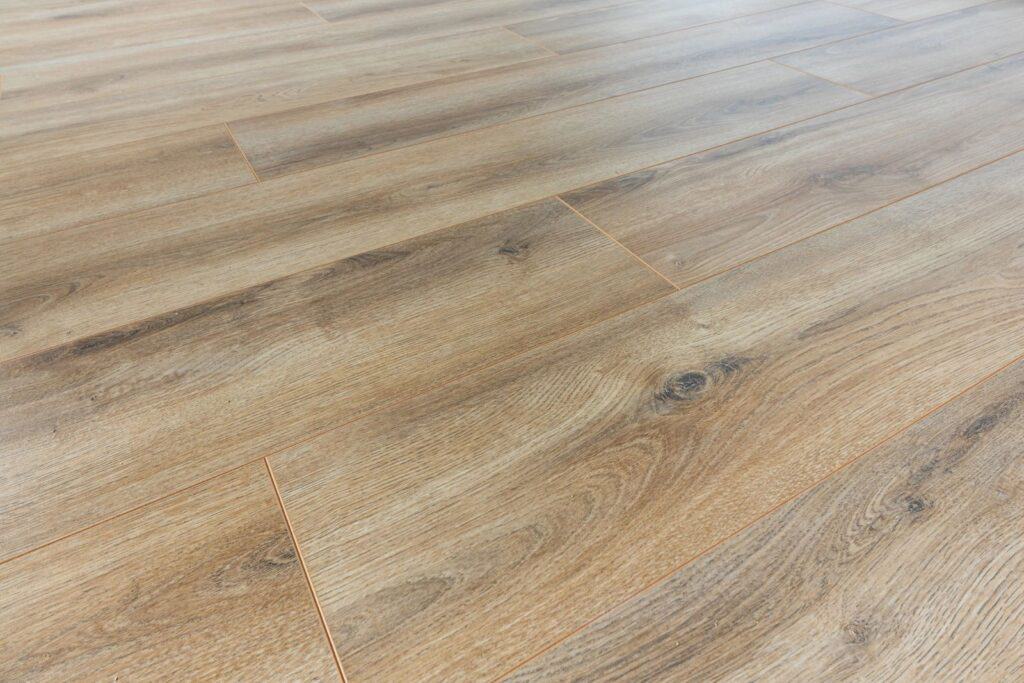 Natural wood-effect laminate flooring in Hamilton garden rooms, offering durable and stylish flooring solutions for garden offices and outdoor spaces.